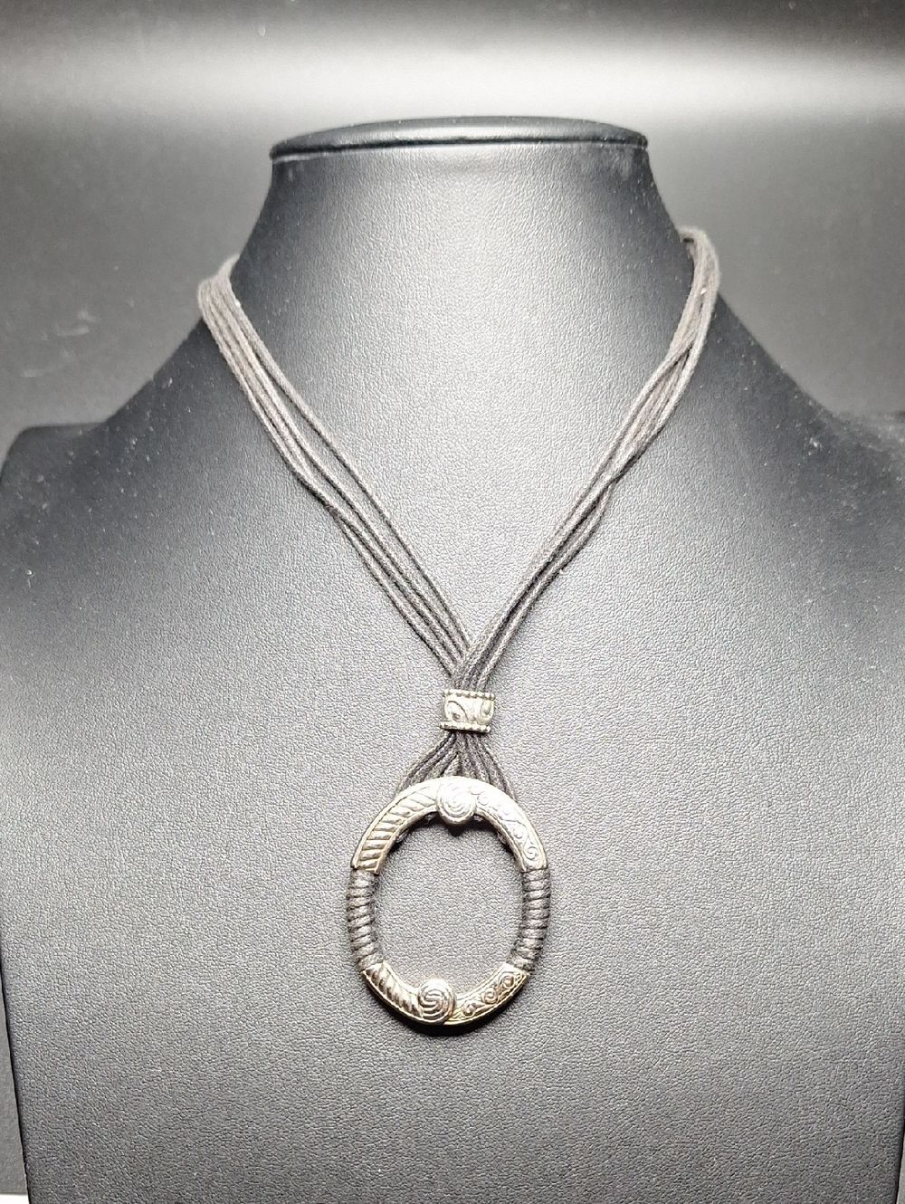 Silver-Tone Circular Pendant Necklace with Black Cord
